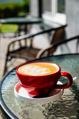 cup of cappuccino in red cup