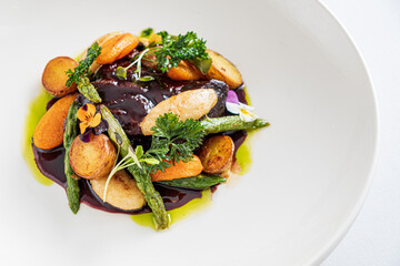 baked vegetables on the white plate