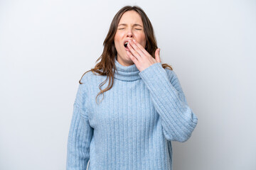 Young caucasian woman isolated on white background yawning and covering wide open mouth with hand