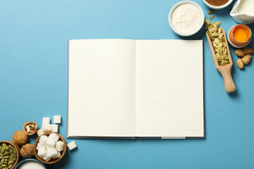 Ingredients and a blank notebook for writing down recipes.
