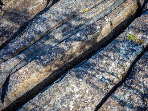water-worn blue-grey stone boulders with deep cracks