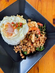 Rice topped with stir-fried pork and basil, Rice topped with stir fried minced pork and basil with Fried egg
