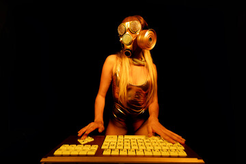 Female with gasmask on computer