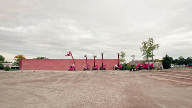 Telescopic Boom Lift on a construction dirty lot. scissor lifts, aerial