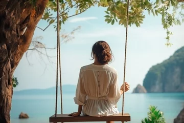 Photo sur Plexiglas Railay Beach, Krabi, Thaïlande Generative AI : Traveler woman relaxing on swing above Andaman sea Railay beach Krabi
