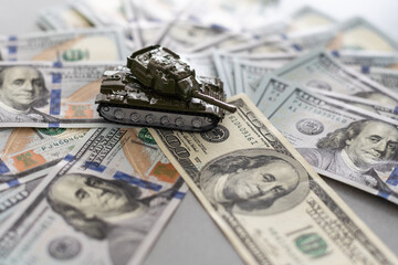 tank against the background of dollars. Concept of war.