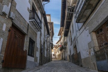 Stone street surrounded by old houses in the medieval village of Candelario, Salamanca, Spain