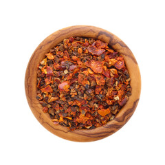 Pepper flakes spice in wooden bowl isolated on white background
