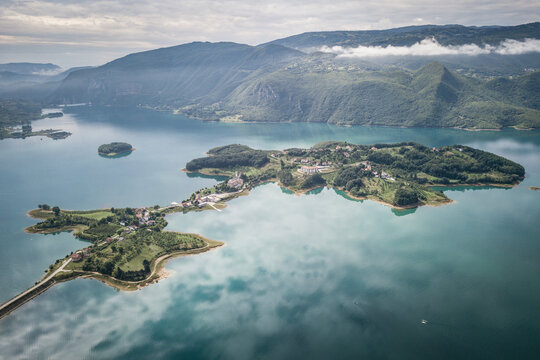 Aerial view of a island of Ramsko Jezero (Rama lake) in Prozor-Rama, Bosnia and Herzegovina.