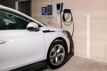 Electric Car in EV Charging Station in Garage or Car Parking, Private Parking Space with ev Charger...