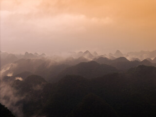 Aerial view of dawn on mountain at Ngoc Con ward, Trung Khanh town, Cao Bang province, Vietnam with river, nature, green rice fields. Near Ban Gioc waterfall.