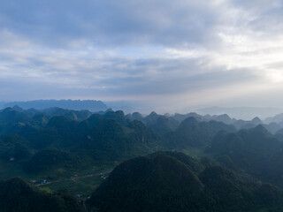 Fototapeta na wymiar Aerial view of Thung mountain in Tra Linh, Cao Bang province, Vietnam with lake, cloudy, nature.