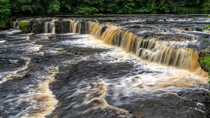 a waterfall with large flowing waterfalls on the sides and on each side