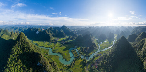 Aerial landscape in Phong Nam valley, an extreme scenery landscape at Cao bang province, Vietnam with river, nature, green rice fields - obrazy, fototapety, plakaty