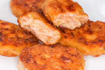 Fried breaded fish cutlets made with minced salmon close-up