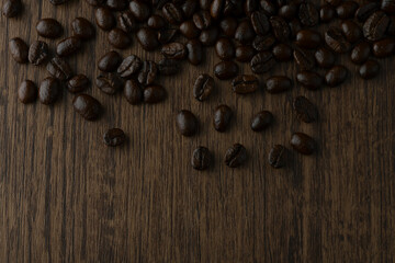 Roasted coffee bean on wooden table.