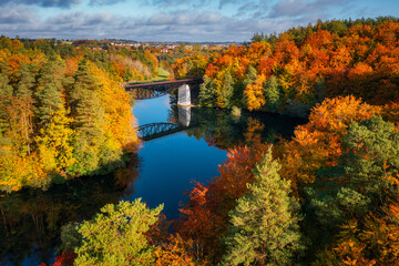 Fototapeta na wymiar Autumnal landscape of the forest and twisted Radunia river in Kashubia. Poland