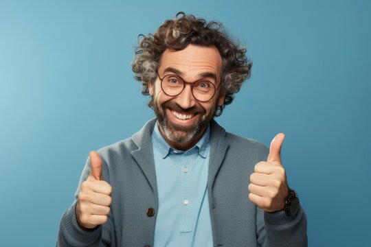 Happy man crossing his fingers thumb up on blue background. Studio fashion photo shot. Generate Ai