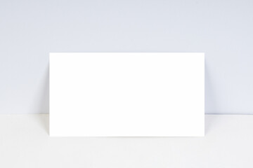 blank business cards on white background with copy space. - obrazy, fototapety, plakaty