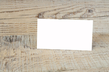 Blank business cards on the wooden table. Template for ID. Top view.