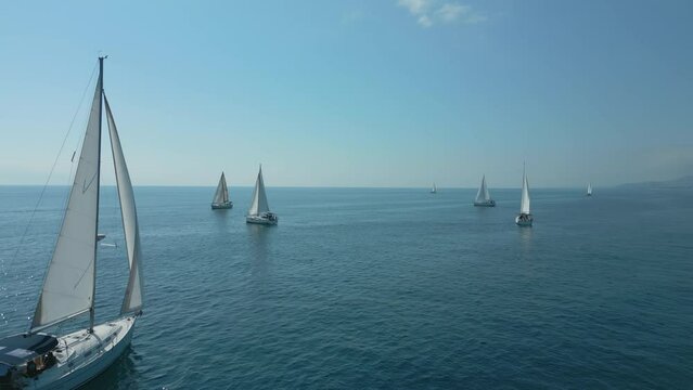 Yacht with white sails at sea. Yachting, luxury vacation and regatta at Cambrils