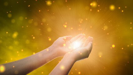 Conceptual Visualization Of Male Or Female Hands Reaching Out In Prayer On Magical Dark Yellow...