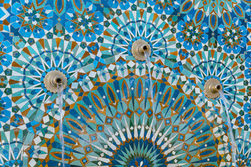 The Hassan II Mosque exterior water fountain decorated with a beautiful moroccan mosaic pattern in...