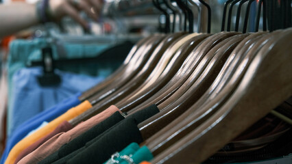 Fototapeta premium dresses on hangers close-up in a women's clothing store