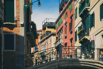 Obraz premium View from the front of the gondola of Venice canals and architecture of the city during ride along one of the canals in Venice, Italy.
