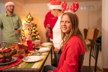 Group of happy family smiling happy celebrating christmas toasting with wine. Family member enjoy...