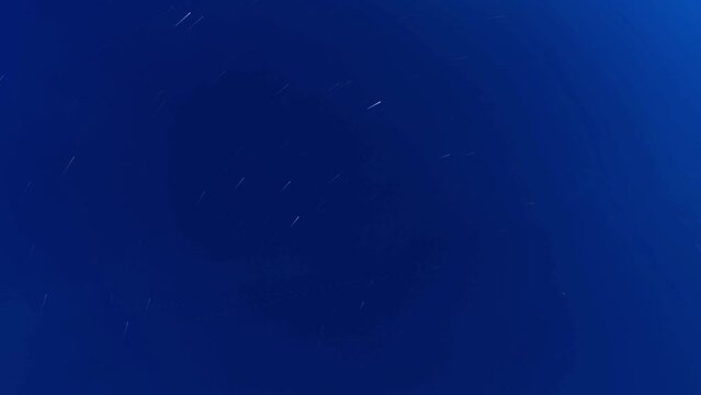 Night sky in time lapse with startrails in a black sky