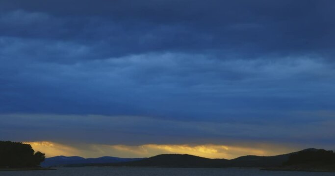 Heavy clouds and strong wind with waves in the evening on the Adriatic coast in Istra during sunset, Croatia