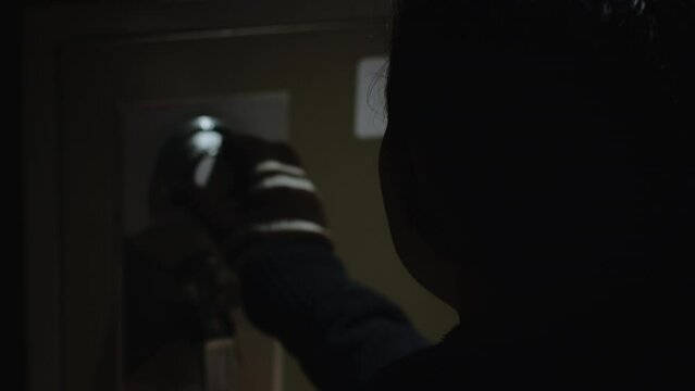 Steal wearing a glove put on a password on dial to open safe box