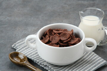 Bowl of cereal chocolate flavor, sweet crunchy 

