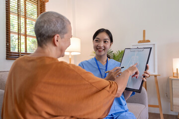 Asian female doctor who consult to patient explains health care symptoms and help elderly woman, Writing down diagnose and symptoms, elderly care, health care