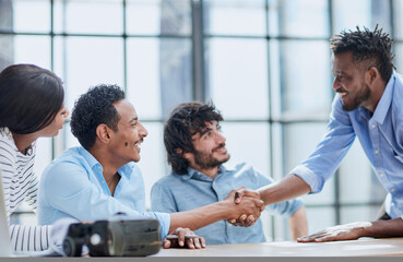 Successful Business Collaboration: Executives Greet with Handshake in Office
