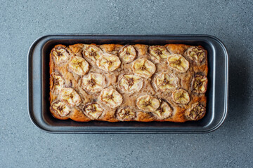 Delicious freshly baked homemade banana bread cake with no gluten and sugar free, top view on grey...