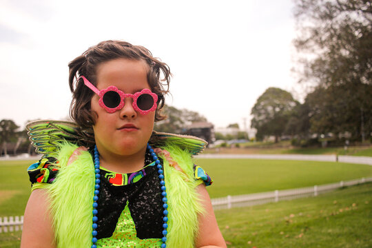 Young girl in fluoro dress-up posing for the camera