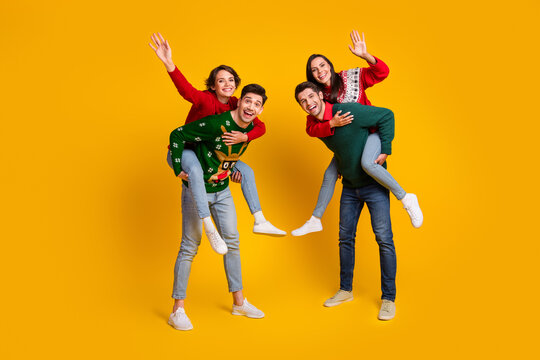 Photo of best buddies have fun piggyback celebrate new year x mas isolated bright color background