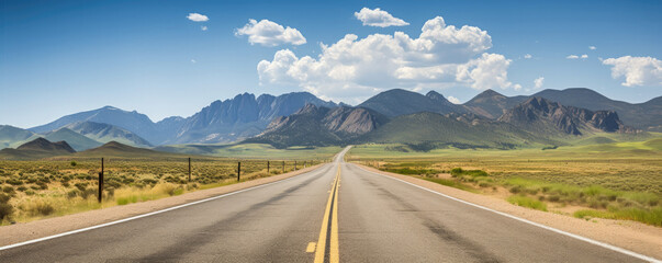 Beautiful road landscape with prairies, mountains, highway and blue sky on a sunny summer day. Landscape with a wide highway. - obrazy, fototapety, plakaty