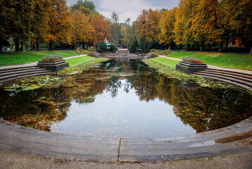 The beautiful Northern Park in the capital Groningen, in the fall with the colored autumn leaves in the trees around the city pond - Powered by Adobe