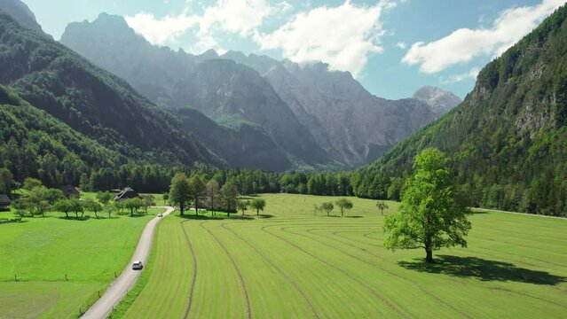 Aerial view of a rural road in alpine scenery of Logar valley, Slovenia