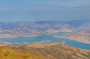 scenic view of Chorvoq lake and Chatkal Mountains from the top of Smaller Chimgan (Bostanliq...