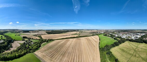 Panorama of the countryside with rolling fields and hedges around Blandford in Dorset in the UK