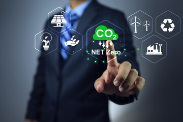 CO2 net zero emission concept. Businessman pointing on renewable clean energy technology and...