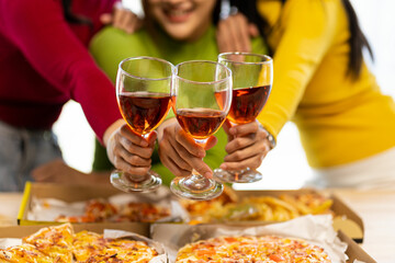 Group of Asian female friends at a party Have a fun time together. pizza party wine drinks Celebrating an important moment