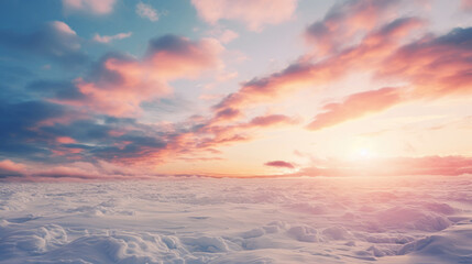 Beautiful winter sunset with fluffy clouds and snow. 