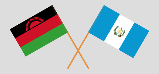Crossed flags of Malawi and Guatemala. Official colors. Correct proportion