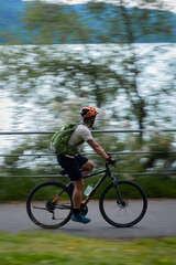 A cyclist riding on the shores of the lake