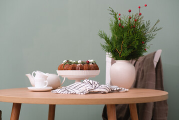 Christmas home interior-Christmas chocolate bundt cake with fresh berries and rosemary. Winter...